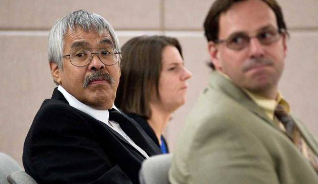 Frank W. Lee, left, and Assistant Public Defender Eric Hedland look toward audible reactions in the public seating area in Juneau Superior Court after the jury found Lee guilty on two of three felony sex crimes in this September 2013 archive photo. (Michael Penn | Juneau Empire)