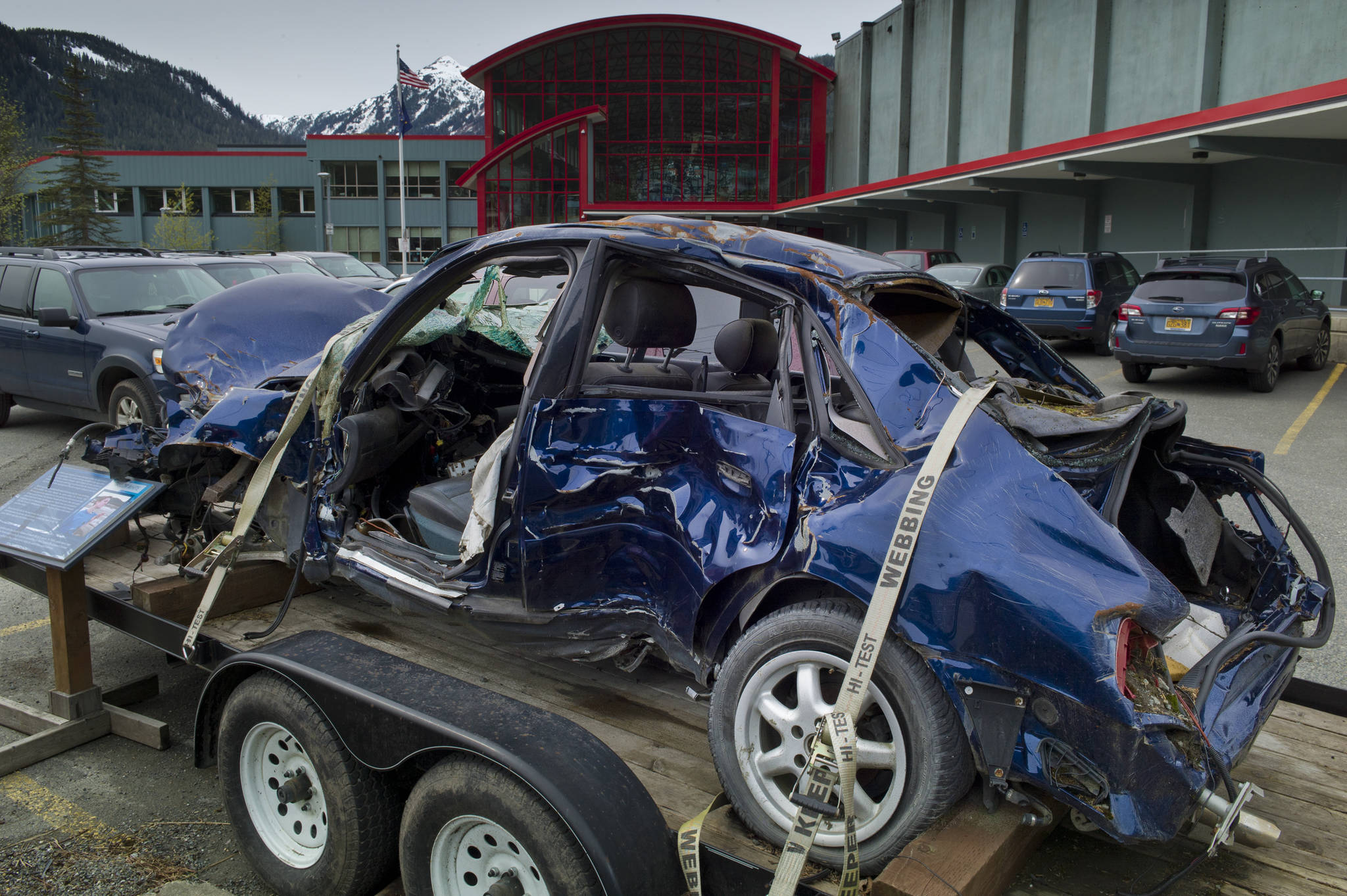 The destroyed vehicle in which Juneau-Douglas High School graduate Taylor White died in June 2009 is on display in front of the school as a reminder to current students of the perils of drinking and driving. (Michael Penn | Juneau Empire File)