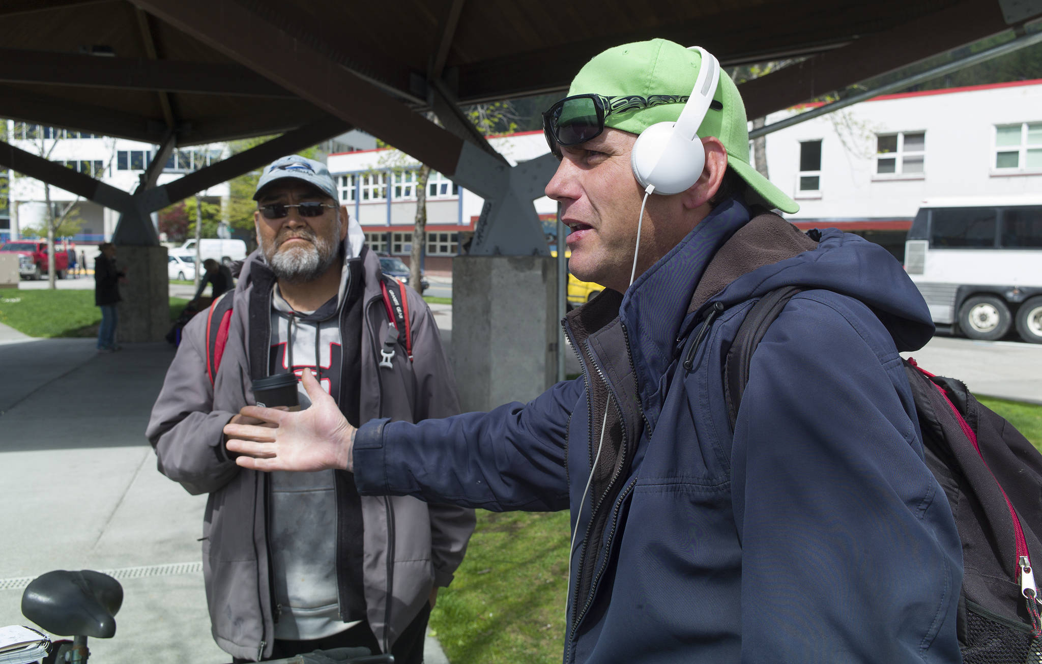 Chawn Summerall, right, and Everett Johnson talk about being harassed by police while at Marine Park on Tuesday, May 23, 2017. Juneau’s homeless population has moved from the doorways of South Franklin Street to Marine Park after the Assembly passed a no-camping ordinance earlier this year. (Michael Penn | Juneau Empire)
