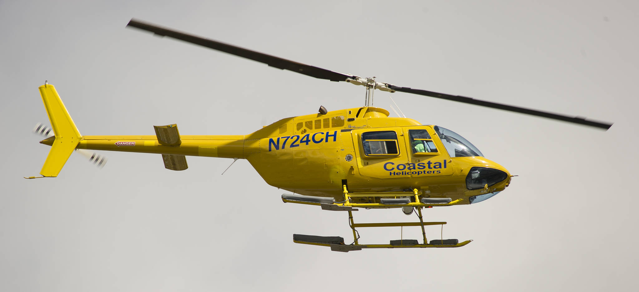 A Coastal Helicopters tour returns to the Juneau International Airport on Tuesday, May 23, 2017. (Michael Penn | Juneau Empire)