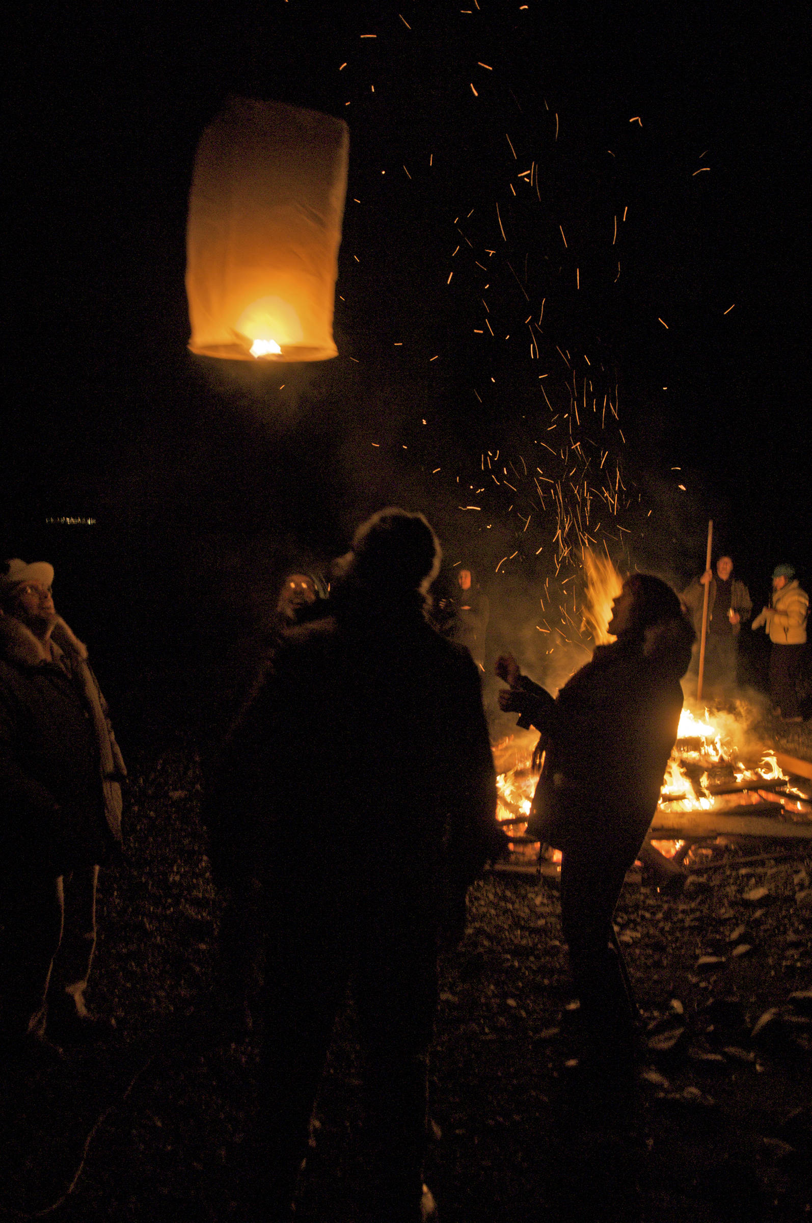 A paper lantern is sent skyward during a winter solstice party in Dec. 2008. (Michael Penn | Juneau Empire)