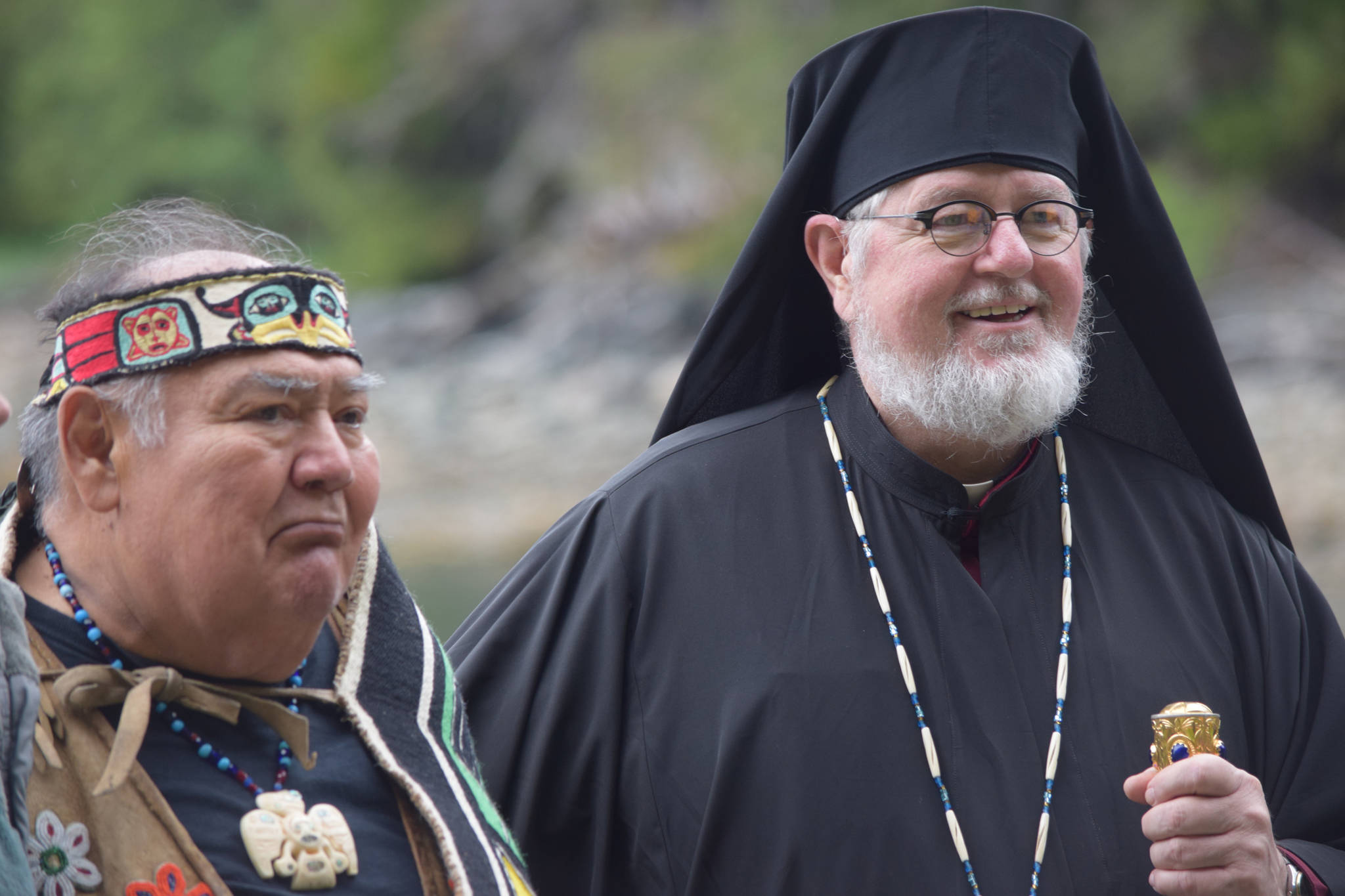 David Katzeek, a Tlingit leader, speaks next to Bishop David (Mahaffey) of the Orthodox Church of Alaska. (Kevin Gullufsen | Juneau Empire)
