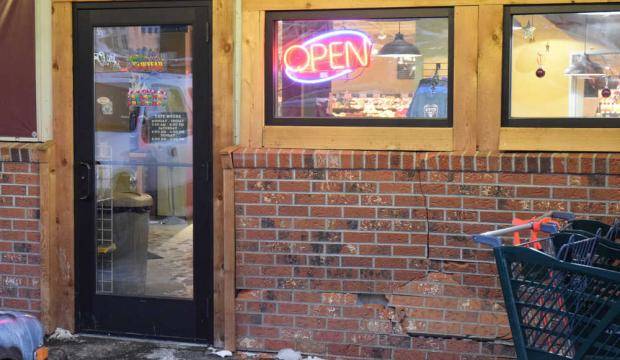 Dented but still open, the front facade of the Foodland IGA grocery store is seen in this archive photo from Dec. 12, 2016. (Kevin Gullufsen&nbsp;| Juneau Empire)