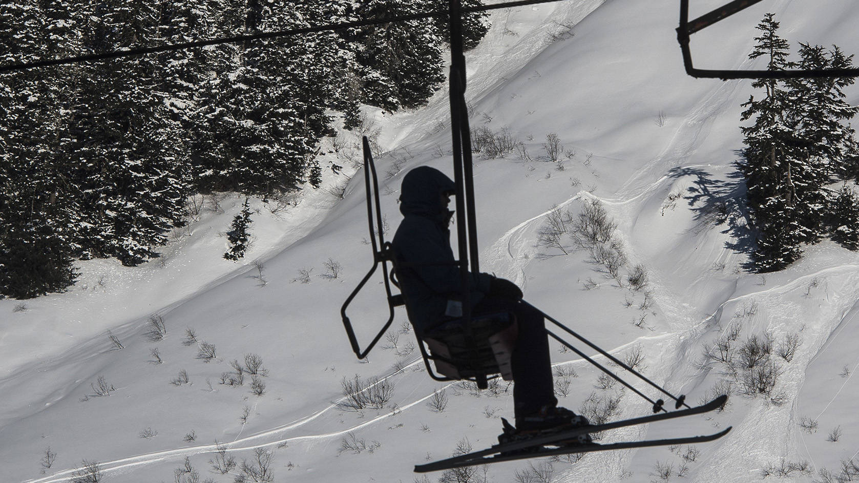 A skier rides the Hooter Chairlift at Eaglecrest. The ski area will be able to serve alcohol moving forward, though it’s unclear whether alcohol sales will start this coming season or next year.
