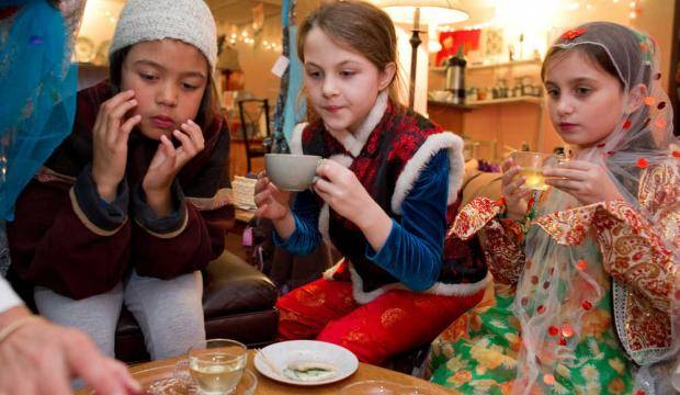 In this file photo from 2011, members of Brownie Troop 4028 watch as tea and sandwiches are served during a gathering. (Michael Penn | Juneau Empire)