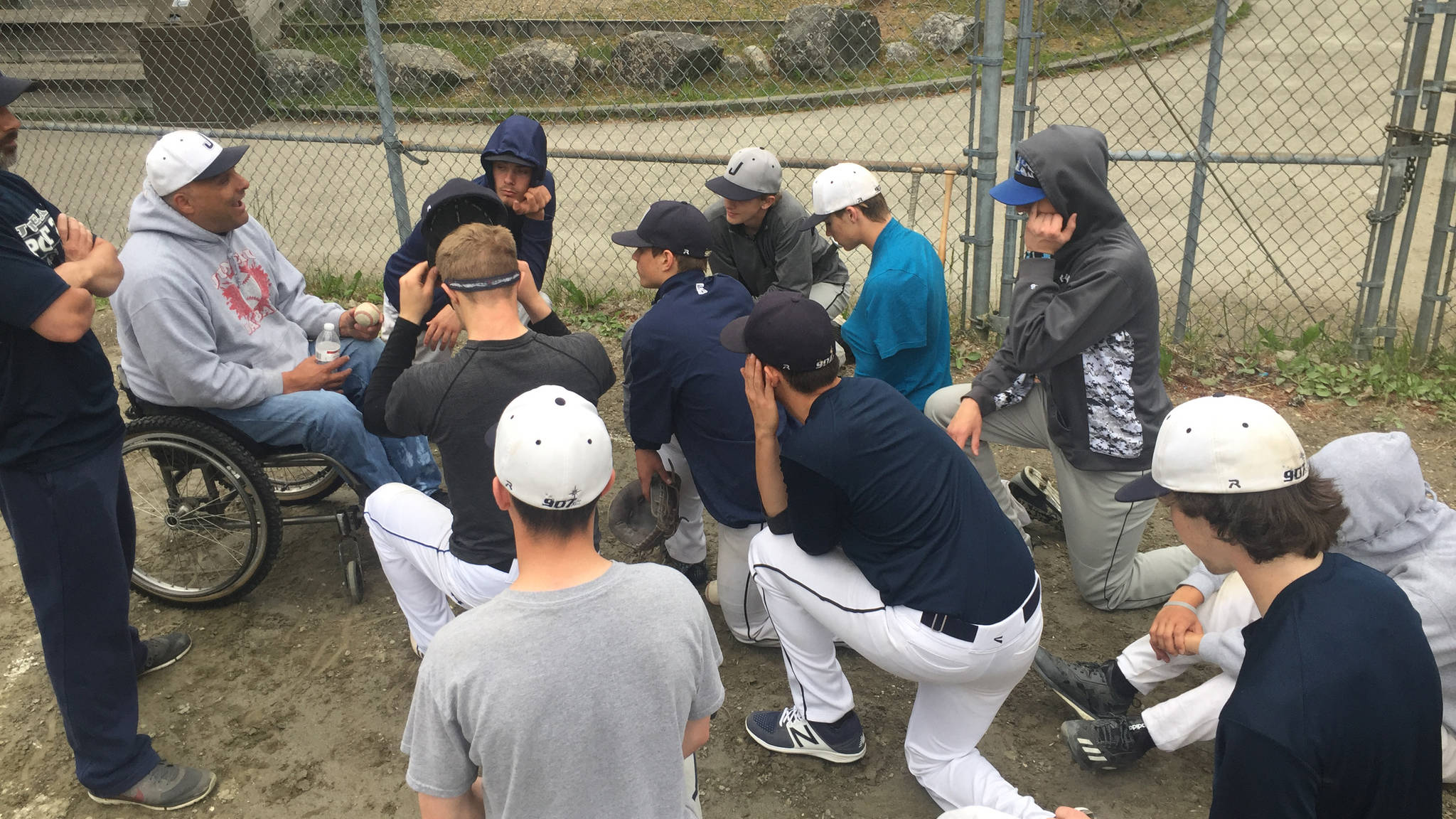 American Legion Juneau Post 25 players listen to coach Joe Tompkins, Tuesday, June 6, at Adair-Kennedy Field after practice. (Nolin Ainsworth | Juneau Empire)