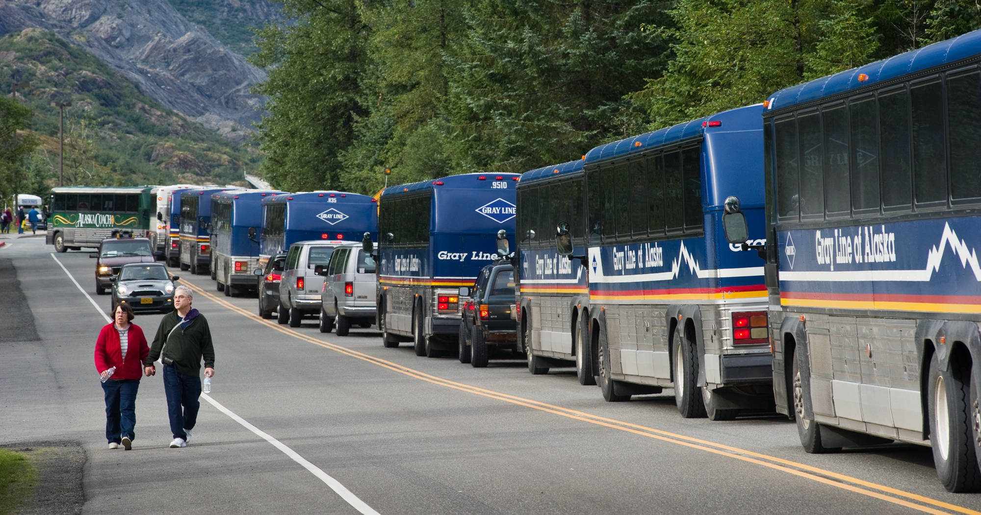 In this August 2013 file photo, buses line up to pick up tourists at the Mendenhall Glacier Visitor Center.(Michael Penn | Juneau Empire file)