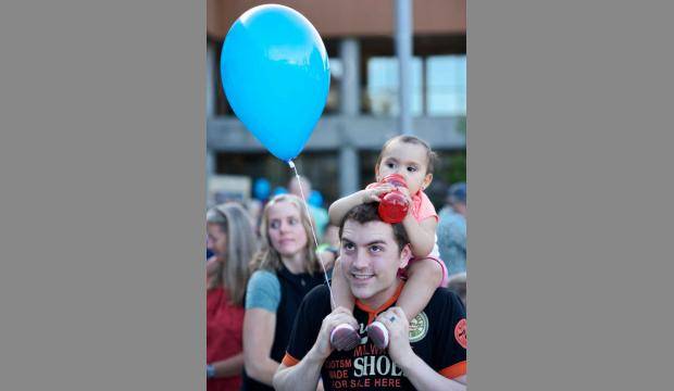 In this file photo from 2015, Ryan Hosman attends a picnic with his daughter, Dahlia, 2, in Juneau.