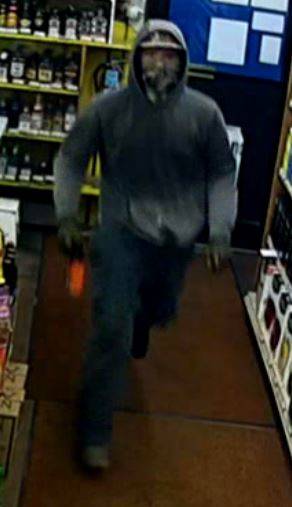 This surveillance video still shows a burglary suspect at the Liquor Barrel store Monday night. (Photo courtesy the Juneau Police Department)