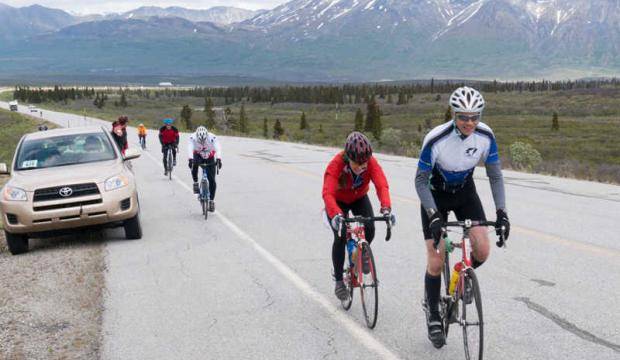 In this file photo from 2014, Juneau&rsquo;s Scott May, right, rides in the Kluane Chilkat International Bike Relay. (Photo courtesy Jim Grammel)