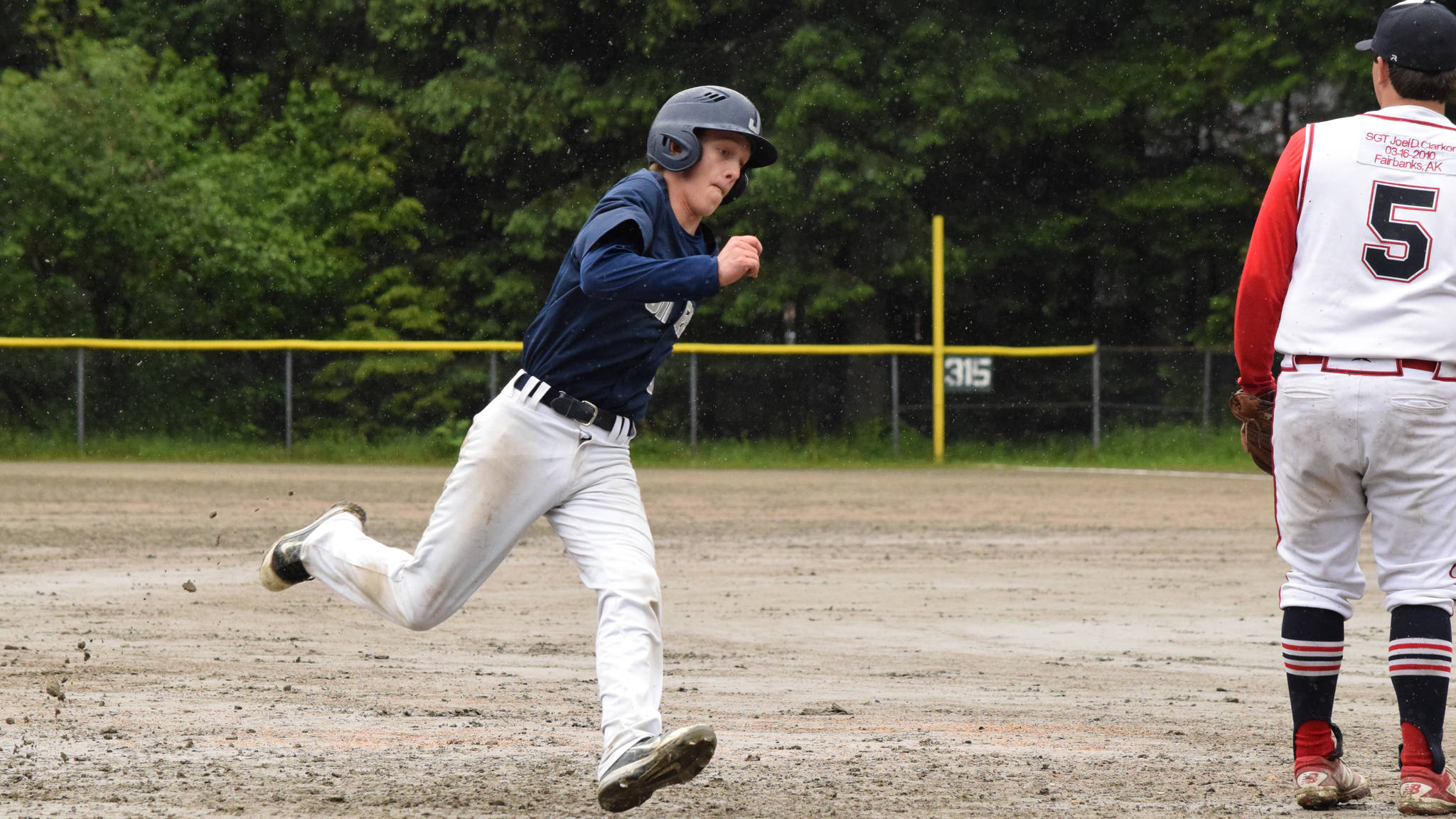 Juneau Post 25’s Zeb Storie rounds third base on his way to score against Wasilla Saturday afternoon. Post 25 won 14-2 over Wasilla. (Nolin Ainsworth | Juneau Empire)
