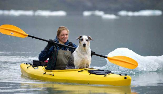 In this file photo from 2012, Misty Butler takes her dog, Bridger, for a spin on Mendenhall Lake. (Michael Penn | Juneau Empire File)