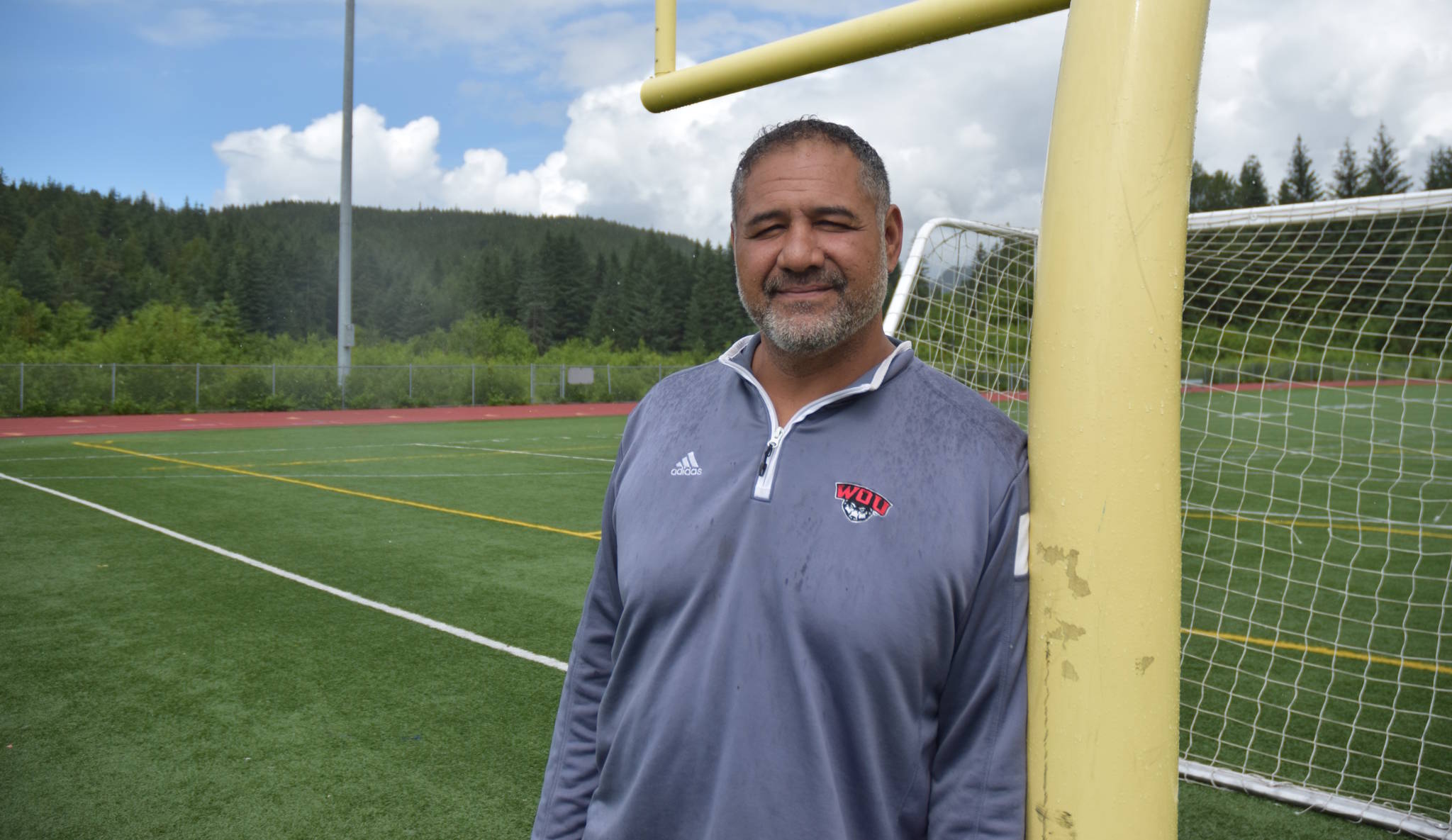 Kimo von Oelhoffen, 46, shown at the Thunder Mountain High School turf field Thursday, June 22. von Oelhoffen visited Juneau with Western Oregon University athletics colleague Cori Metzgar in preparation for the Juneau Football and Sports Performance Camp coming to town July 10-14. (Nolin Ainsworth | Juneau Empire)