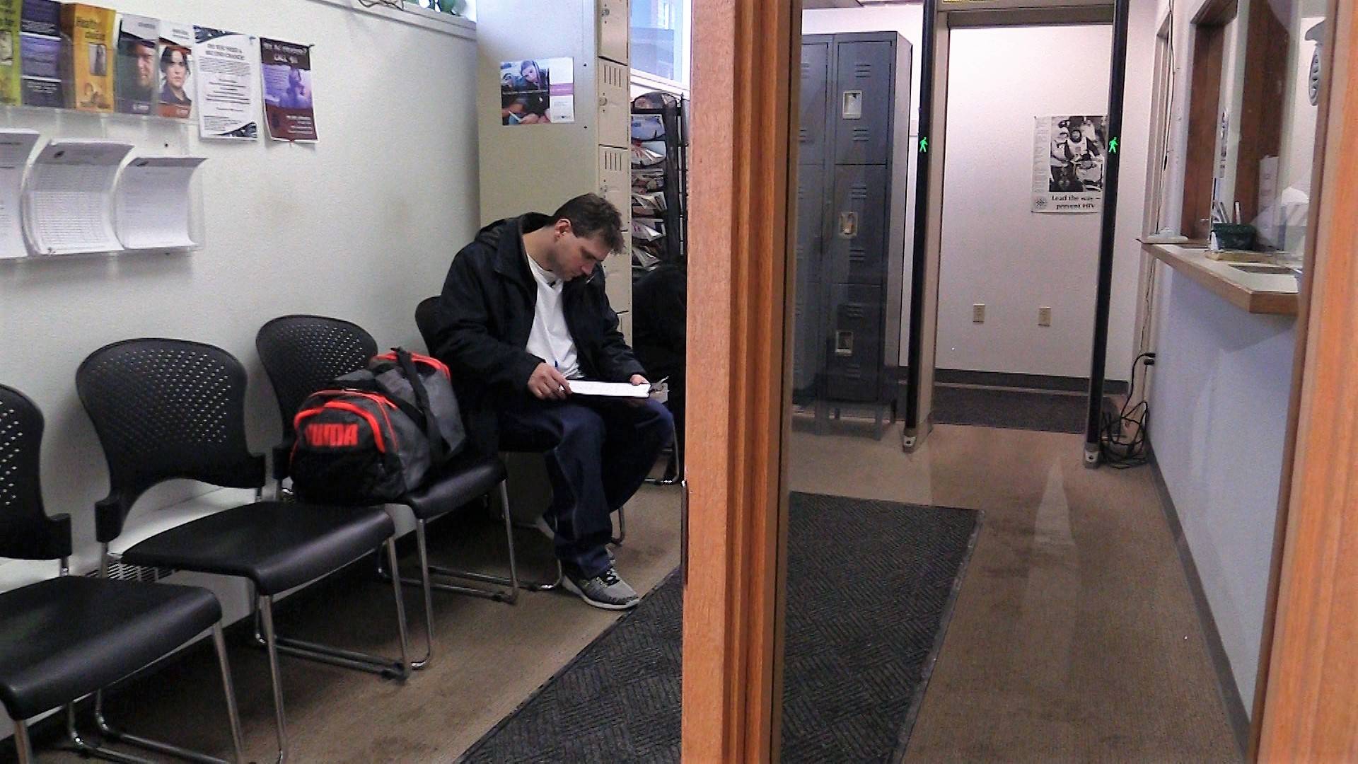 Chawn Summerall studies his paperwork at the probation department in downtown Juneau after his release from prison. (Photo courtesy of 360 North)
