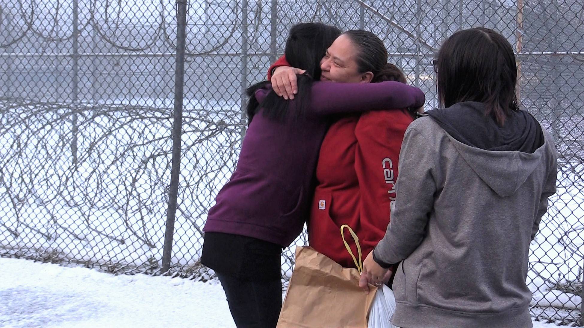 Michelle Bennett, center, is greeted by friends and family members on her release from Lemon Creek Correctional Center. PHOTO COURTESY OF 360 NORTH