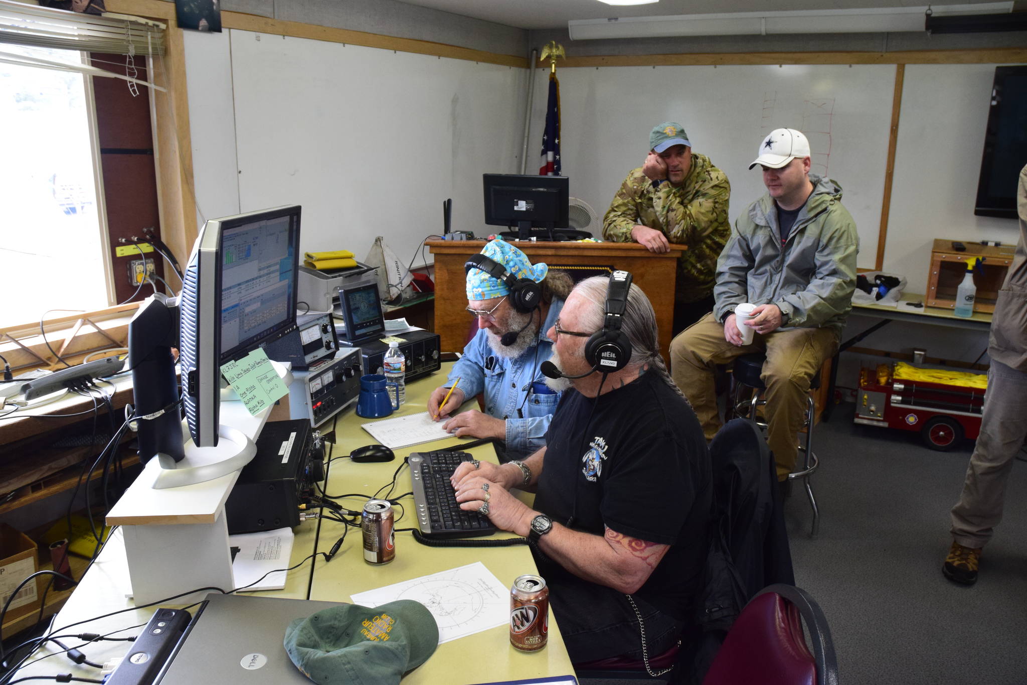 Jerry Prindle, front, and Howard Shepard work to contact amateur radio operators across North America on Saturday. (Kevin Gullufsen | Juneau Empire)