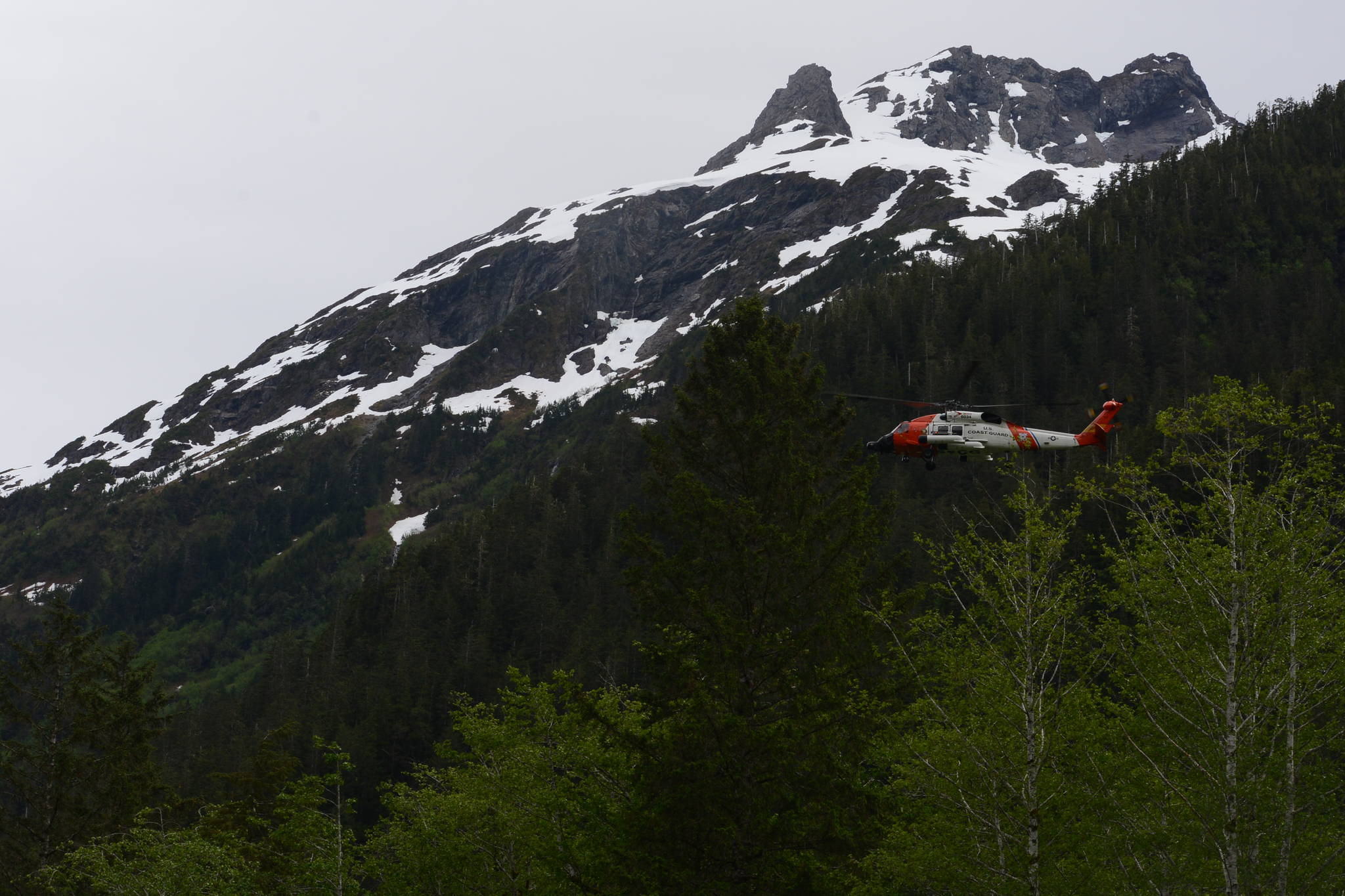 An MH-60 Jayhawk helicopter from the Coast Guard Air Station Sitka searches for missing Hydaburg man Frances Charles on June 23. The search was suspended the next day after no trace of Charles was found. (Photo courtesy of the United States Coast Guard)