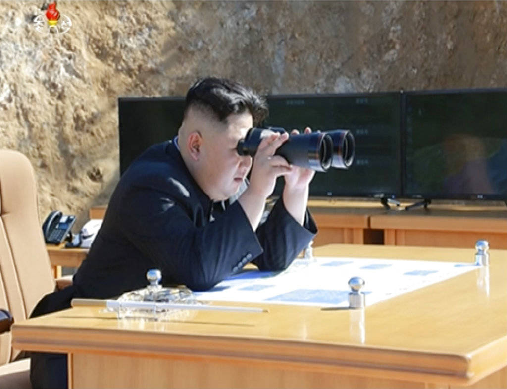 This image made from video of a news bulletin aired by North Korea’s KRT on Tuesday, July 4, 2017, shows what was said to be North Korea leader Kim Jung Un, center, using binoculars to watch the launch of a Hwasong-14 intercontinental ballistic missile, ICBM, in North Korea’s northwest. Independent journalists were not given access to cover the event depicted in this photo. North Korea claimed to have tested its first intercontinental ballistic missile in a launch Tuesday, a potential game-changing development in its push to militarily challenge Washington — but a declaration that conflicts with earlier South Korean and U.S. assessments that it had an intermediate range. (KRT via AP Video)
