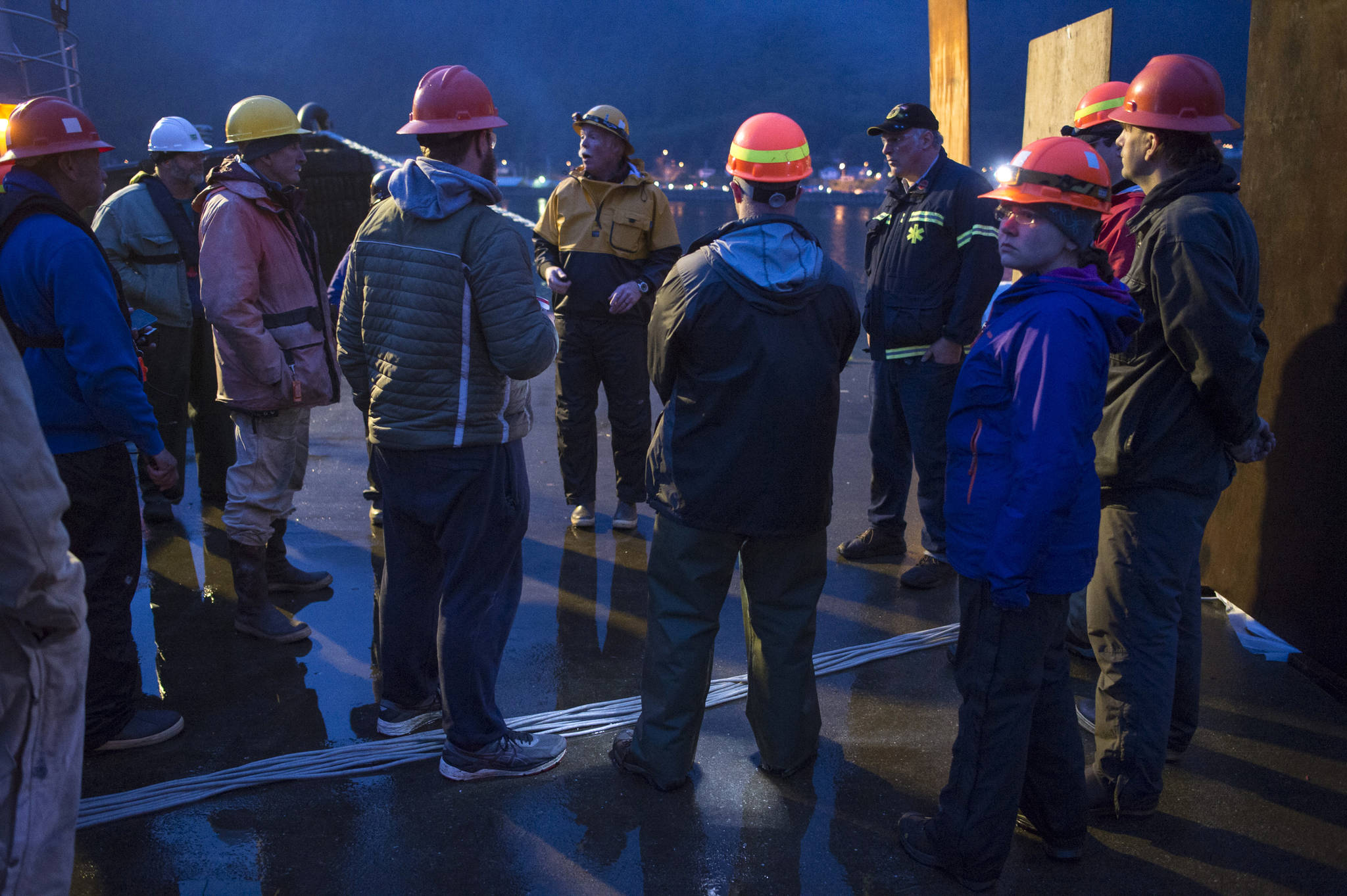 Gary Stambaugh, center, leads a safety briefing with volunteers before the annual city-funded fireworks show in Juneau’s downtown harbor on Tuesday, July 3, 2017. (Michael Penn | Juneau Empire)