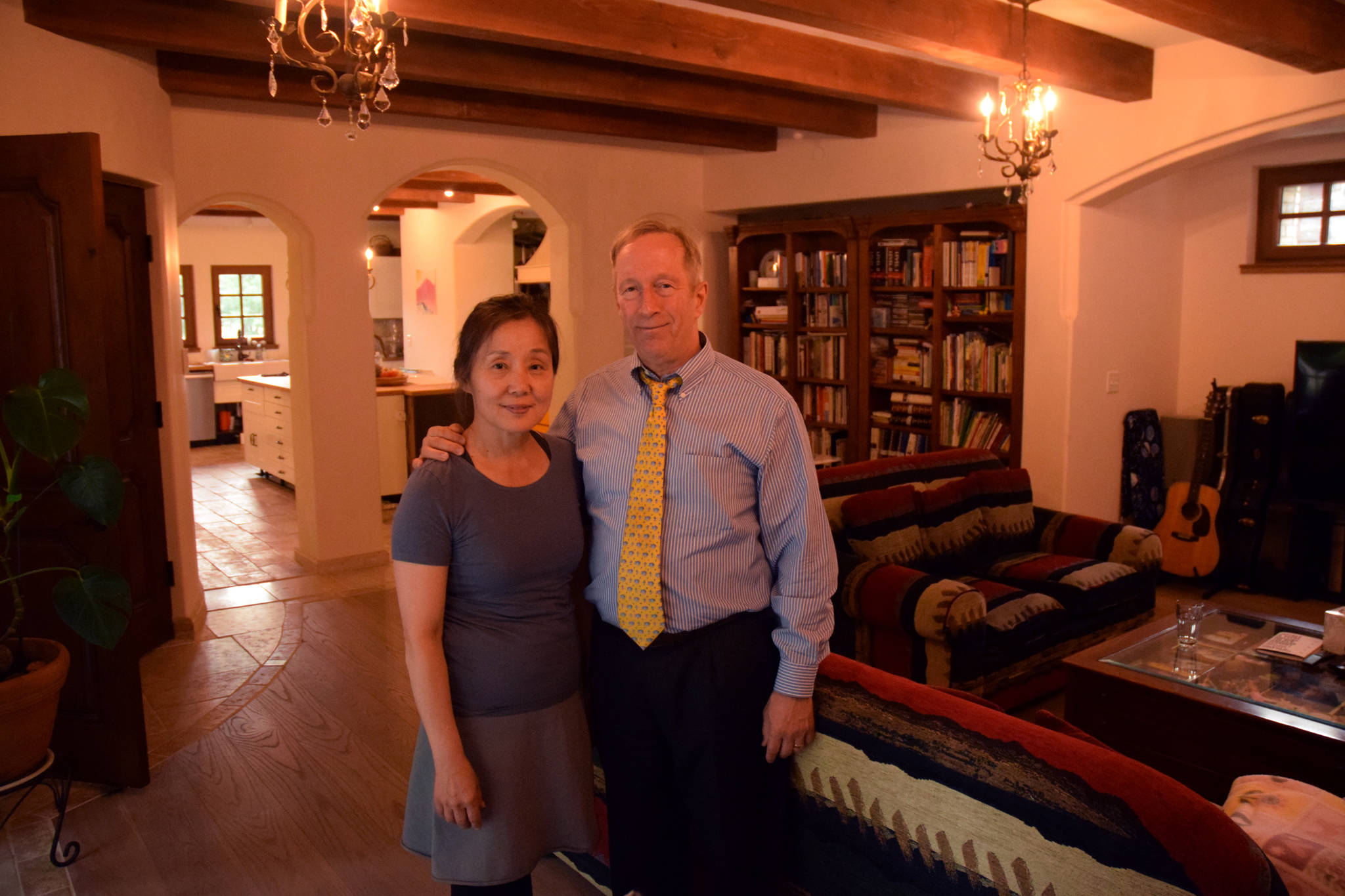 PHOTOS BY James Brooks | Juneau Empire  Sun Hee and Mark Choate stand in the living room of their new home on Thursday.