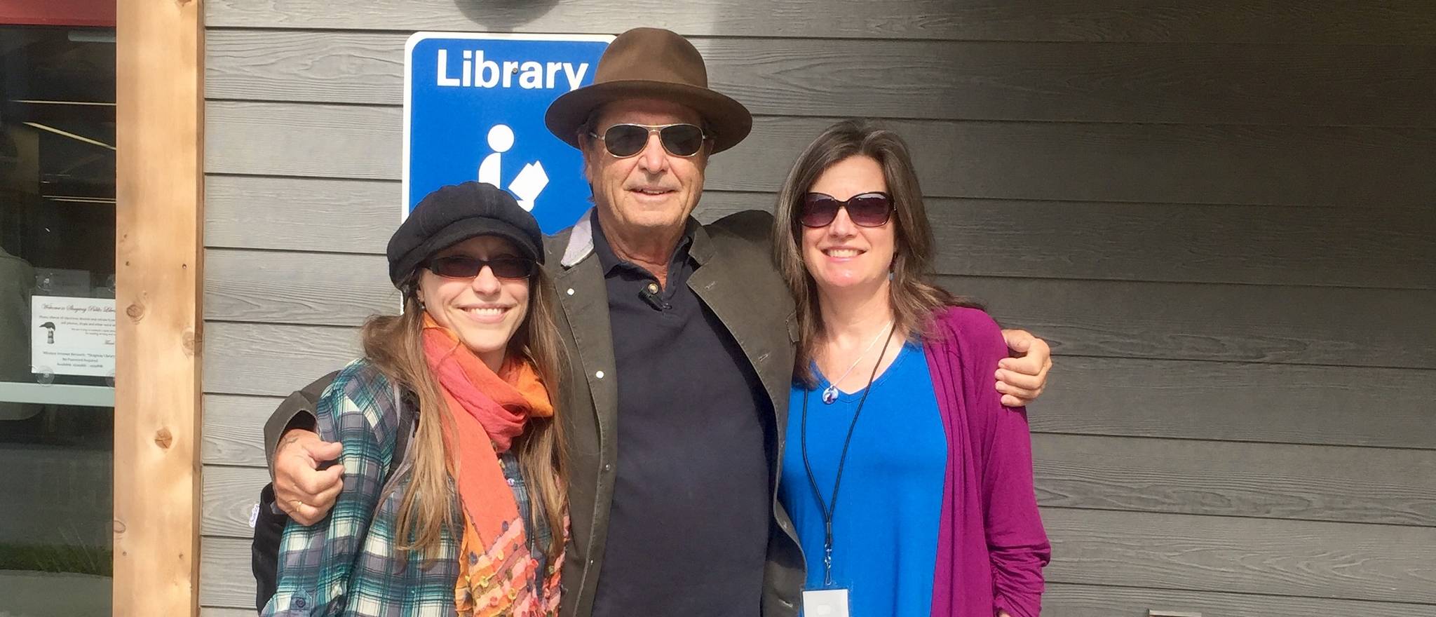 Paul Theroux, Katie Bausler and Amy O’Neill Houck pose together. Image courtesy of Katie Bausler.
