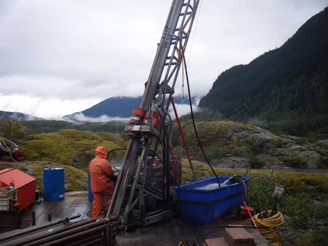Looking for gold, workers operate a drill near Herbert Glacier. (Photo courtesy Ian Klassen of Grand Portage Resources Ltd.)