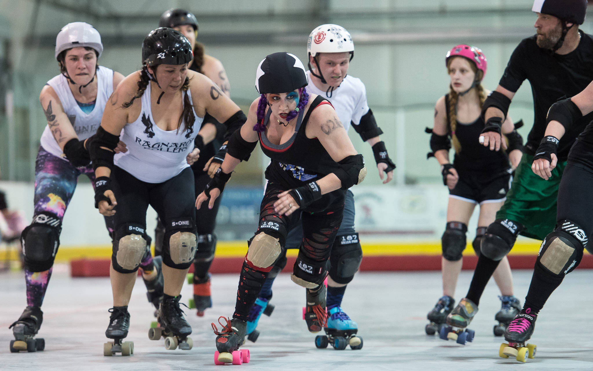 Shari &ldquo;Juke-N-Cherry&rdquo; Dundas, visiting from Anchorage, breaks out of the pack during the Juneau Rollergirls first Mashup of the year at the Treadwell Arena on Friday, July 14, 2017. (Michael Penn | Juneau Empire)
