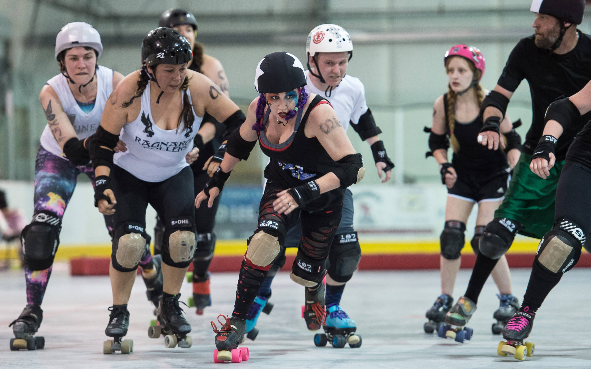 Shari “Juke-N-Cherry” Dundas, visiting from Anchorage, breaks out of the pack during the Juneau Rollergirls first Mashup of the year at the Treadwell Arena on Friday, July 14, 2017. (Michael Penn | Juneau Empire)