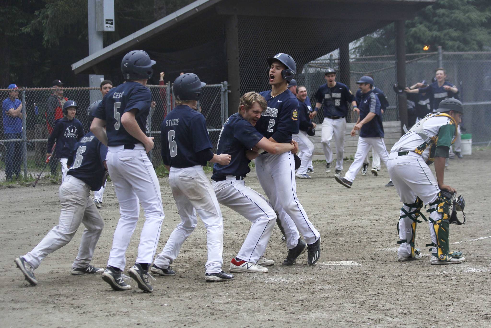 Owen Mendoza scores the winning run in Juneau Post 25’s walk-off 4-3 victory over Service Post 28 Saturday at Adair-Kennedy Memorial Park. Mendoza scored from first base on Alex Muir’s game-winning double. (Alex McCarthy | Juneau Empire)