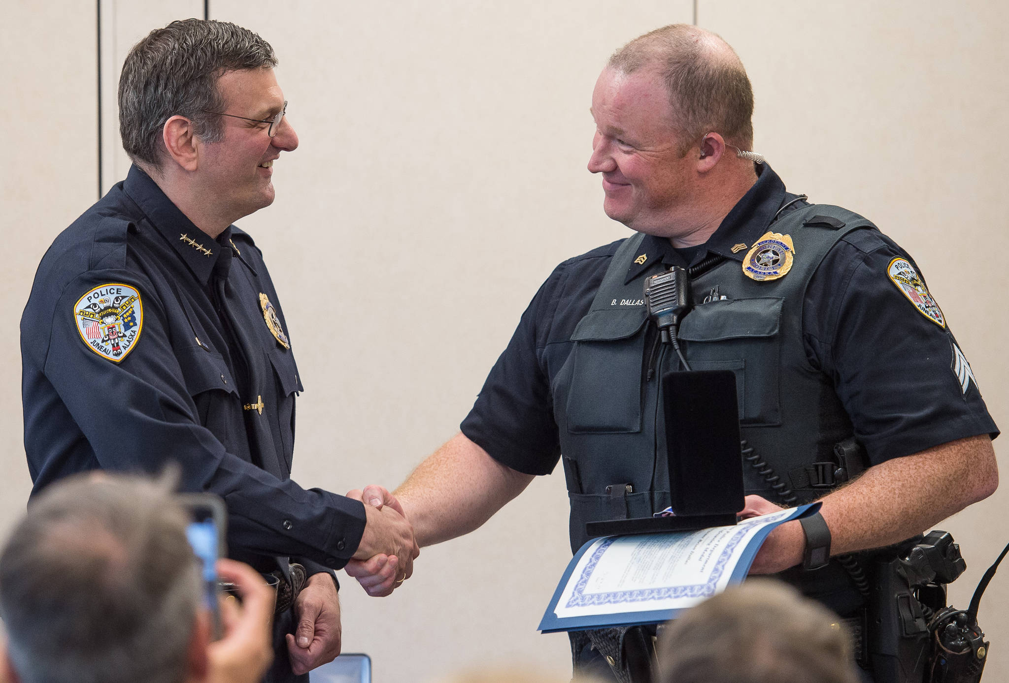 Juneau Chief of Police Bryce Johnson, left, hands out a Lifesaving Award to Officer Brian Dallas during the Juneau Police Department’s quarterly awards ceremony on Monday, July 24, 2017. Juneau Chief of Police Bryce Johnson, left, hands out a Lifesaving Award to Officer Brian Dallas during the Juneau Police Department’s quarterly awards ceremony on Monday, July 24, 2017.