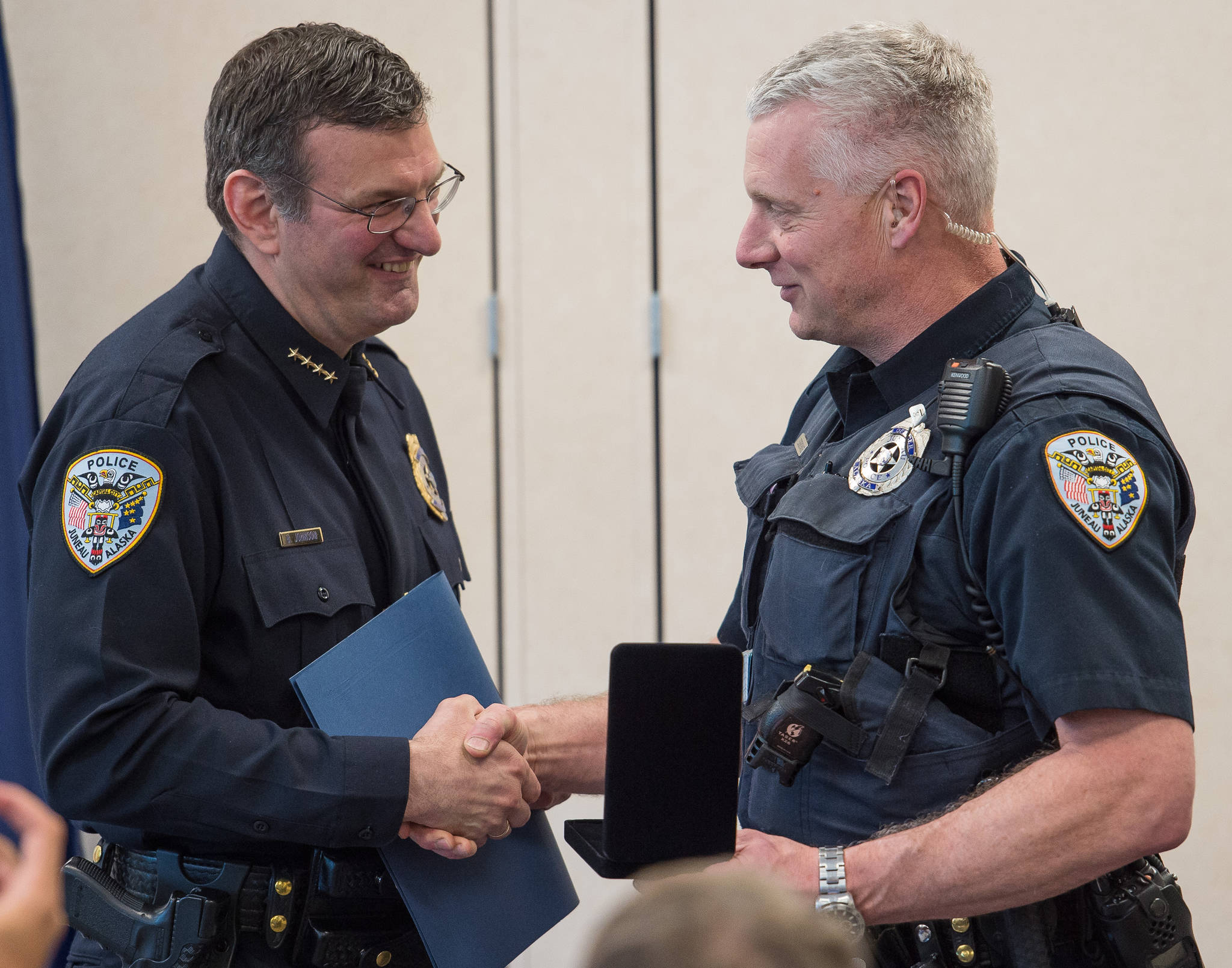 Juneau Chief of Police Bryce Johnson, left, hands out a Lifesaving Award to Officer James Esbenshade during the Juneau Police Department’s quarterly awards ceremony on Monday, July 24, 2017. Juneau Chief of Police Bryce Johnson, left, hands out a Lifesaving Award to Officer James Esbenshade during the Juneau Police Department’s quarterly awards ceremony on Monday, July 24, 2017.