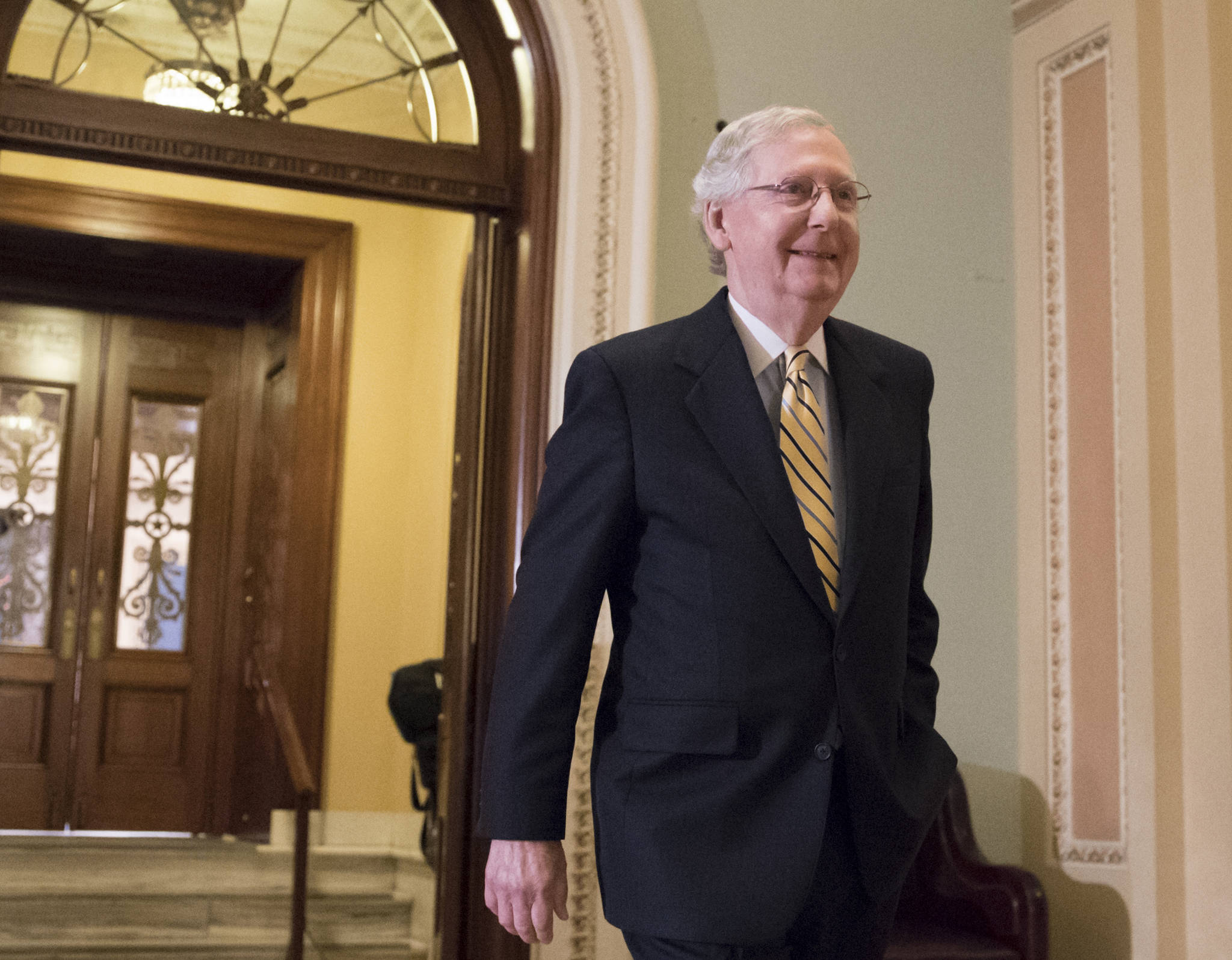 Senate Majority Leader Mitch McConnell, R-Kentucky, walks from the Senate Chamber on Capitol Hill in Washington, D.C. on Tuesday, July 25, 2017, as he steers the Senate toward a crucial vote on the Republican health care bill. (J. Scott Applewhite | The Associated Press)