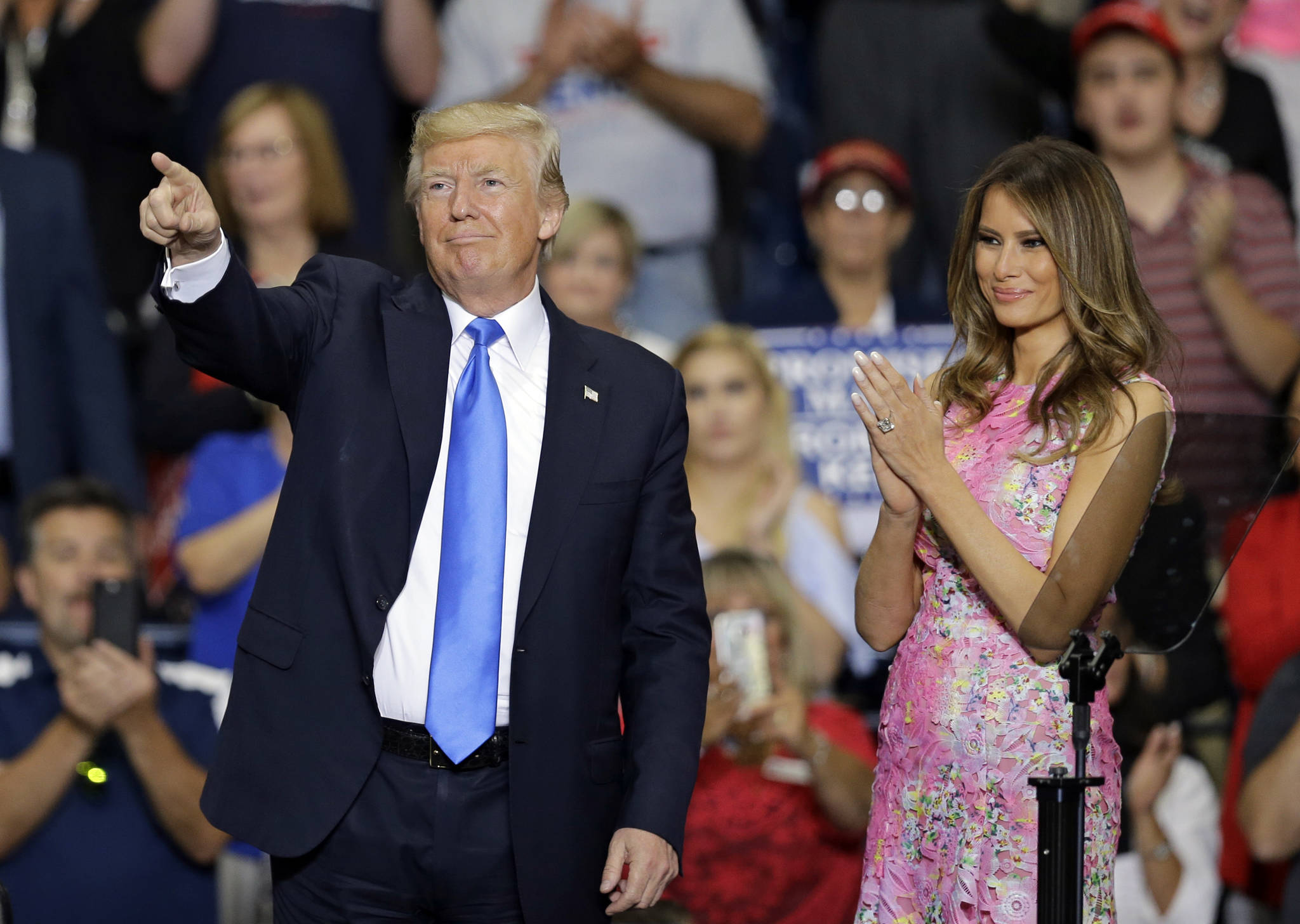 President Donald Trump points to his supporters as first lady Melania Trump watches after speaking at the Covelli Centre, Tuesday, July 25, 2017, in Youngstown, Ohio. (Tony Dejak | The Associated Press)