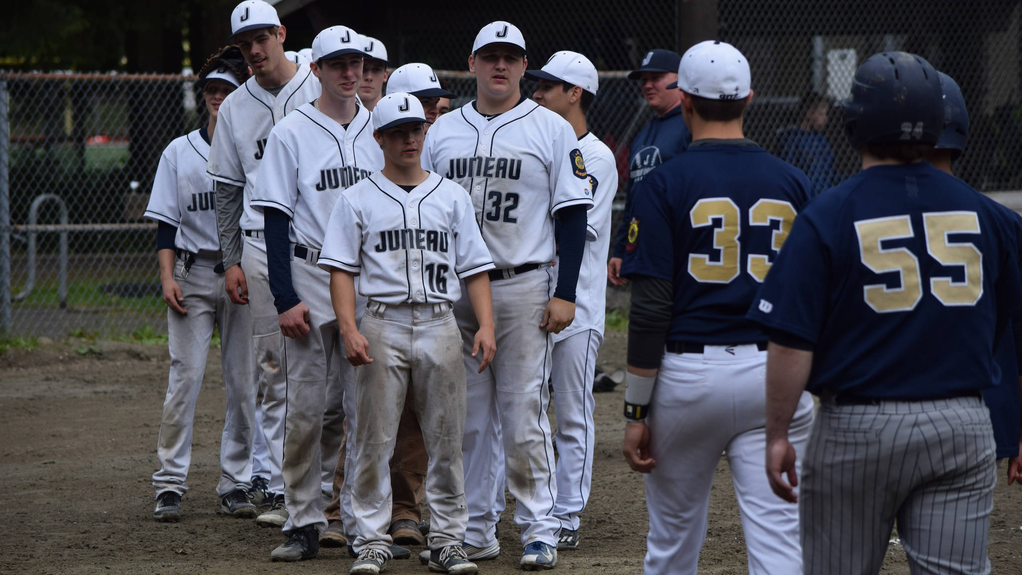 American Legion Post 25 with team alumni earlier this season at Adair-Kennedy Field. (Nolin Ainsworth | Juneau Empire)
