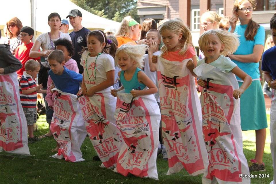 Children participate in a sack race at the Sitka Seafood Festival in 2014. Photo by Bobbi Jordan.