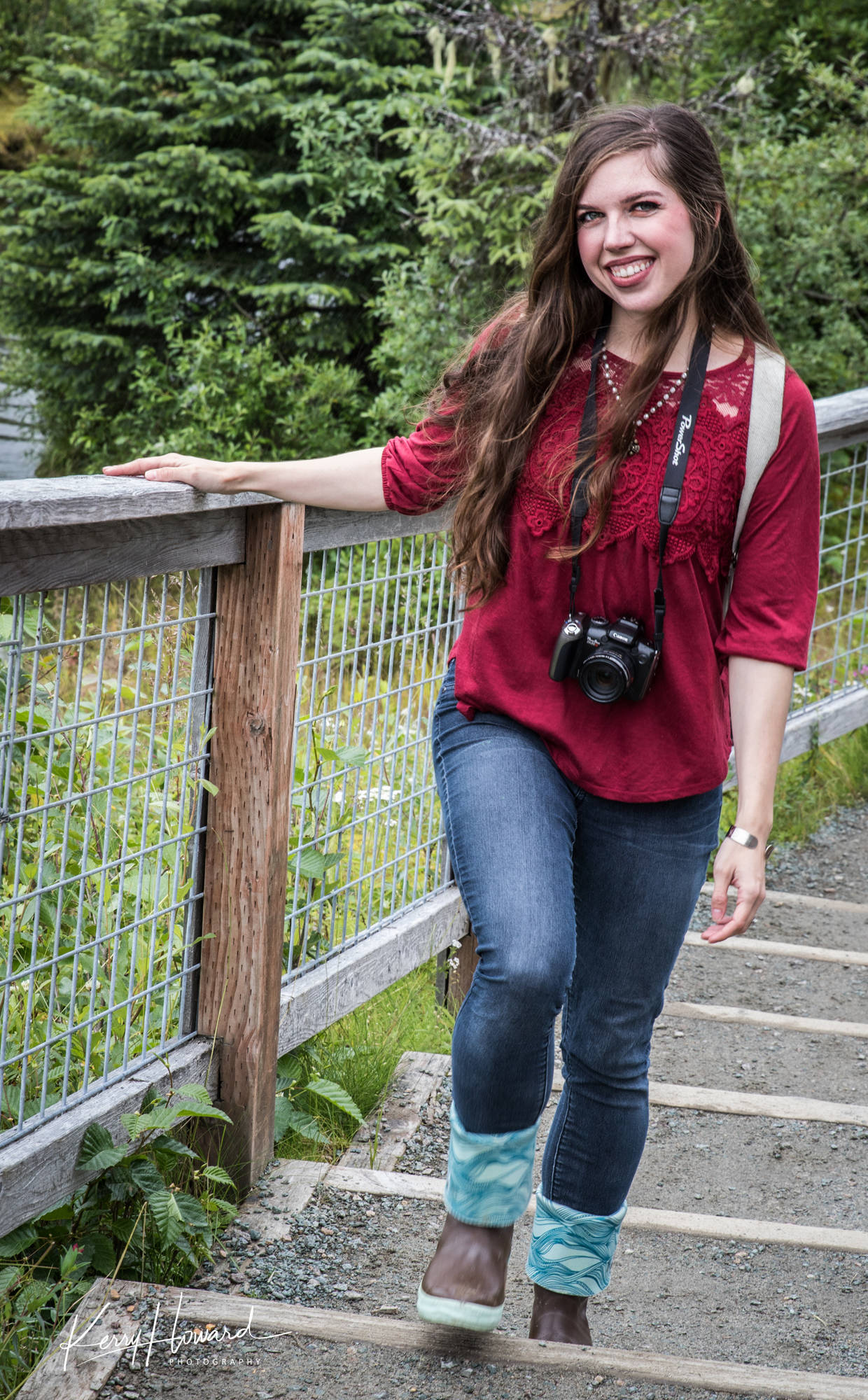 Rebecca proves that a genuine smile is a fashion statement. Add in bright colors, pearls and rolled down Xtratufs and you are ready to hit the trail in style. (Kerry Howard | Juneau Empire)