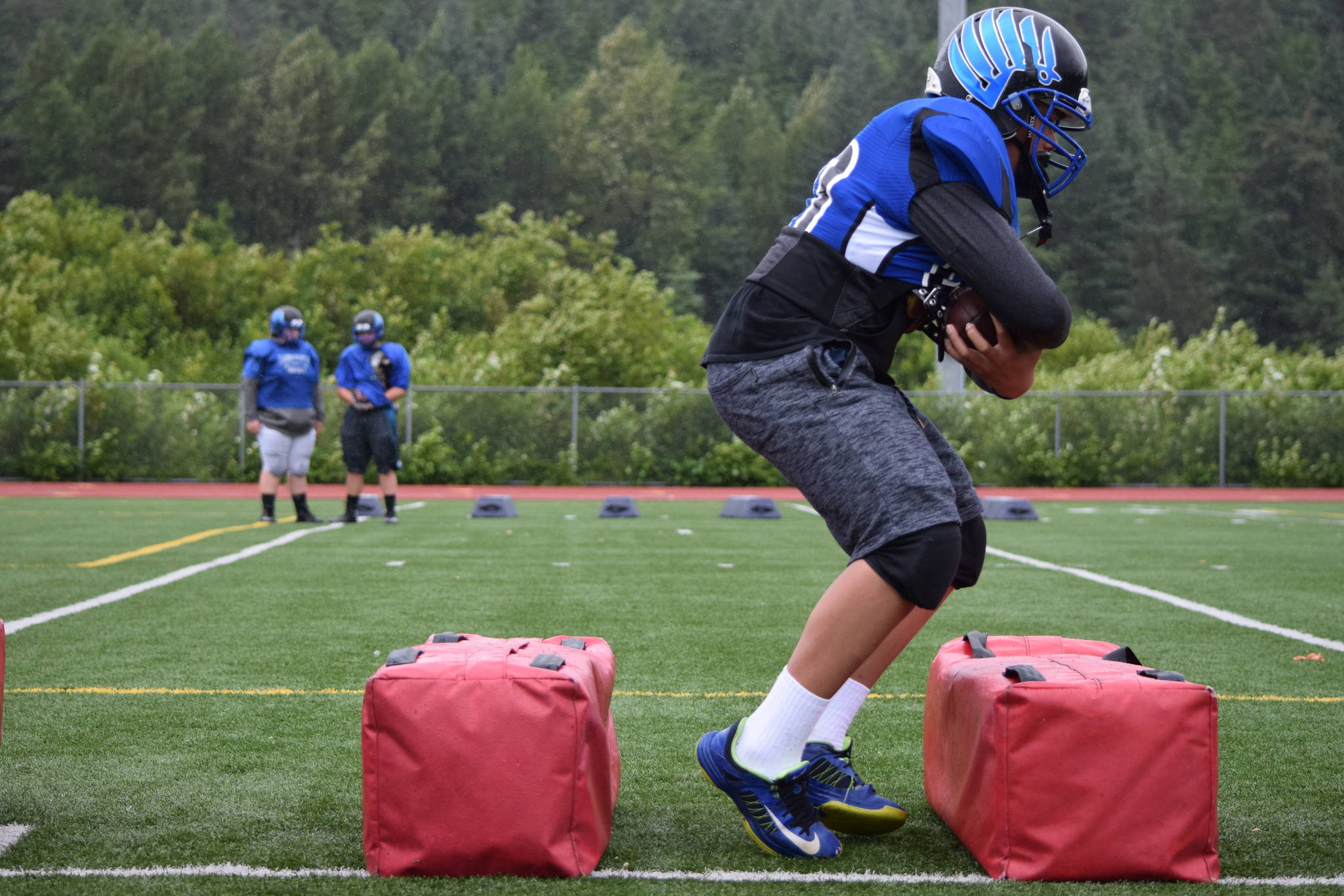 A Thunder Mountain High School football player works out on the first day of practice, Wednesday, July 26. (Nolin Ainsworth | Juneau Empire)