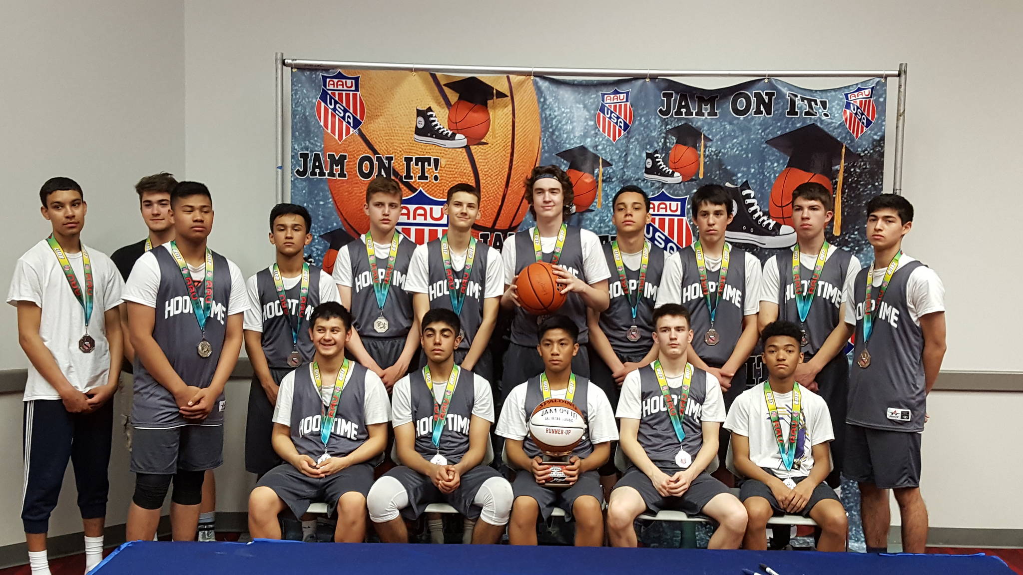 The Juneau HoopTime high school basketball team poses with their second place trophy in the 10th grade division at the Las Vegas Classic. (Photo courtesy of Jeff Jenkins)