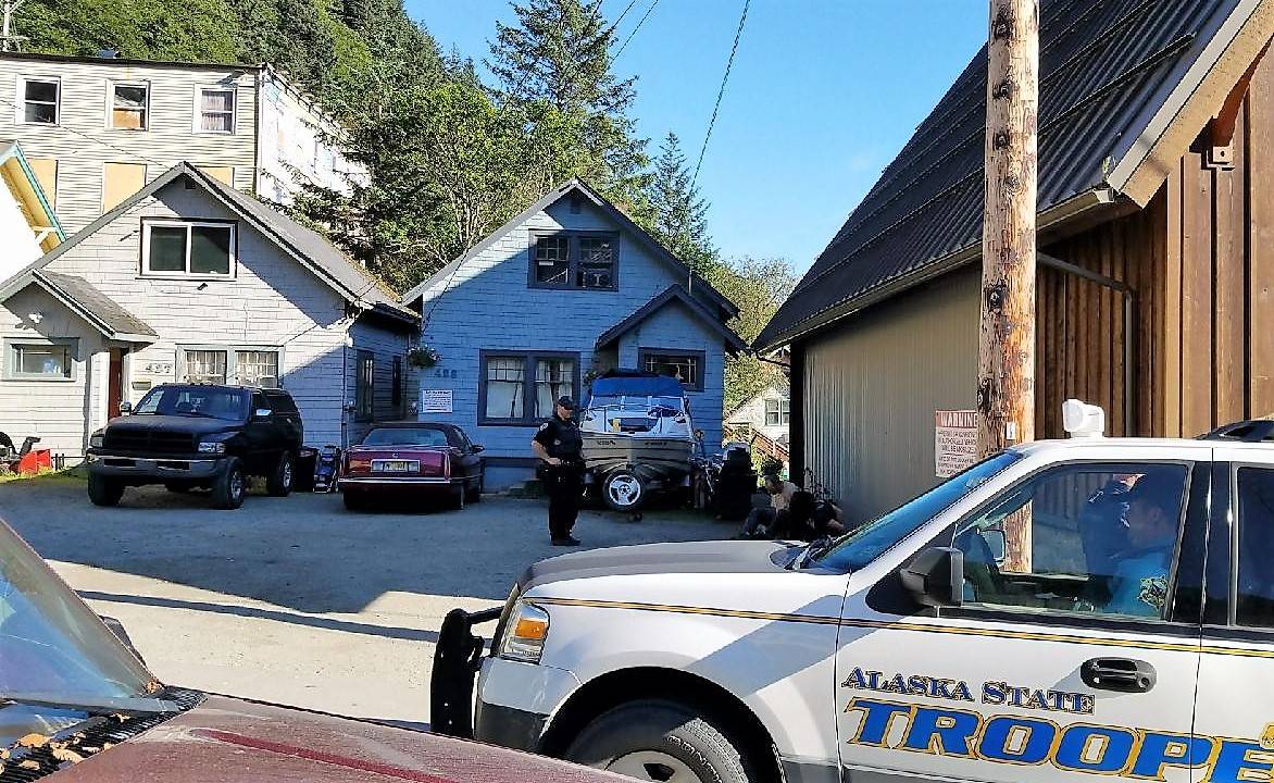 Law enforcement officers from multiple agencies, including Juneau Police, Alaska State Troopers and the FBI served a search warrant at a residence in the 400 block of Fourth Street Wednesday afternoon, just a few days after a warrant search on the neighboring house. (Courtesy photo)