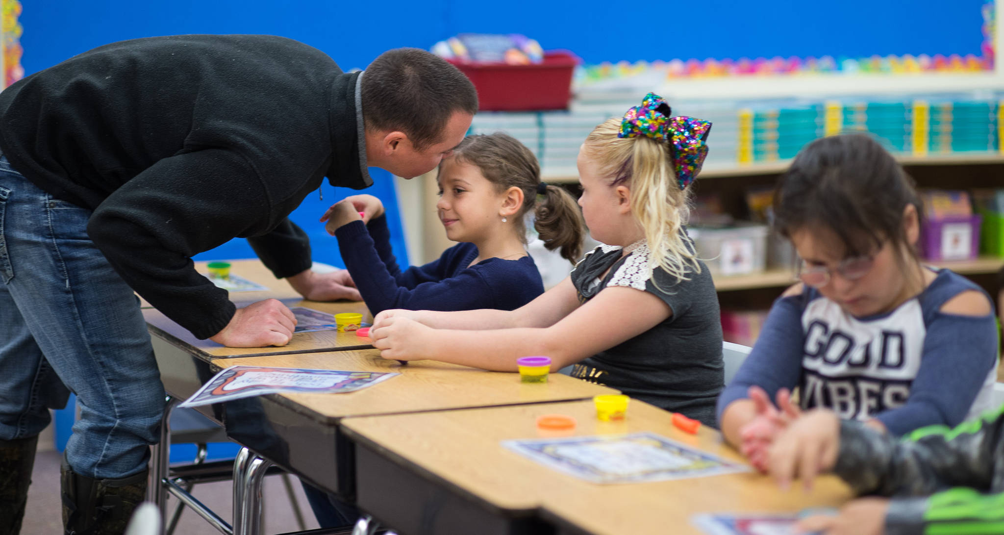 Hailey Thornton receives a kiss from her father, Justin, after he dropped her off at her second grade class on the first day of the school at Riverbend Elementary School on Wednesday, Aug. 16, 2017.