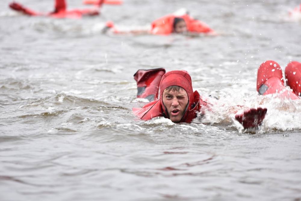 A Coast Guard member gasps for air while competing in the survival swim relay during the Buoy Tender Roundup Olympics in Juneau on Wednesday. Crews aboard Coast Guard buoy tenders in Alaska service 1,350 navigational aids along 33,000 miles of coastline while actively participating in search and rescue, environmental protection and law enforcement missions. (Petty Officer 1st Class Jon-Paul Rios | U.S. Coast Guard)