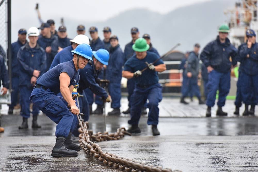 Crewmembers of the Coast Guard Cutter Henry Blake, homeported in Everett, Washington, compete in the chain pull competition during the Buoy Tender Roundup Olympics, at Coast Guard Station Juneau on Wednesday. The event was one of six skill tests the eight buoy tenders attending the Olympics competed in. (Petty Officer 1st Class Jon-Paul Rios | U.S. Coast Guard)