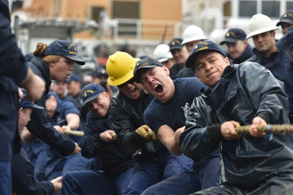Crewmembers of the Coast Guard Cutter Sycamore, homeported in Cordova, Alaska, use every ounce of strength to beat the Coast Guard Cutter Hickory, taking first place in the tug-o-war during the Buoy Tender Roundup Olympics at Coast Guard Station Juneau, Alaska, Aug. 16, 2017. The Olympics is a competition that not only builds morale amongst cutter members but also provides a fun alternative to every day training in events such as the chain pull, survival swim and the heat-and-beat. (Petty Officer 1st Class Jon-Paul Rios | U.S. Coast Guard)