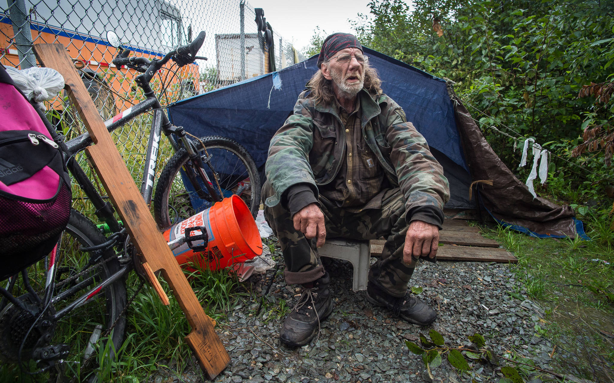 Eugene Graham, who calls himself the Traveler, talks about living in a homeless encampment on property belonging to the Alaska Mental Health Trust Authority on Friday, Aug. 18, 2017. The Trust Authority will give campers a two-week notice to vacate the area starting Tuesday. (Michael Penn | Juneau Empire)