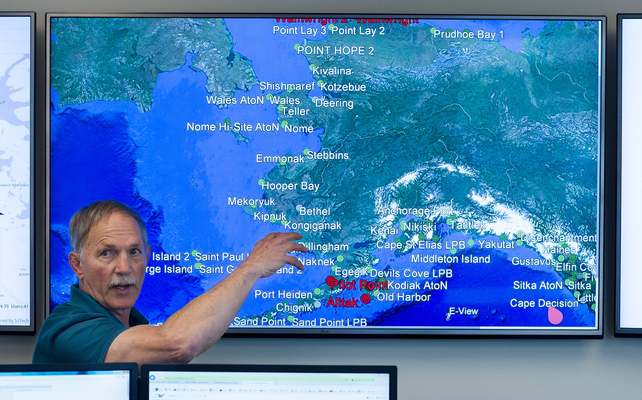 Captain Ed Page explains the vessel tracking system the Marine Exchage of Alaska uses during a tour of their new building on Friday, Aug. 18, 2017. (Michael Penn | Juneau Empire)