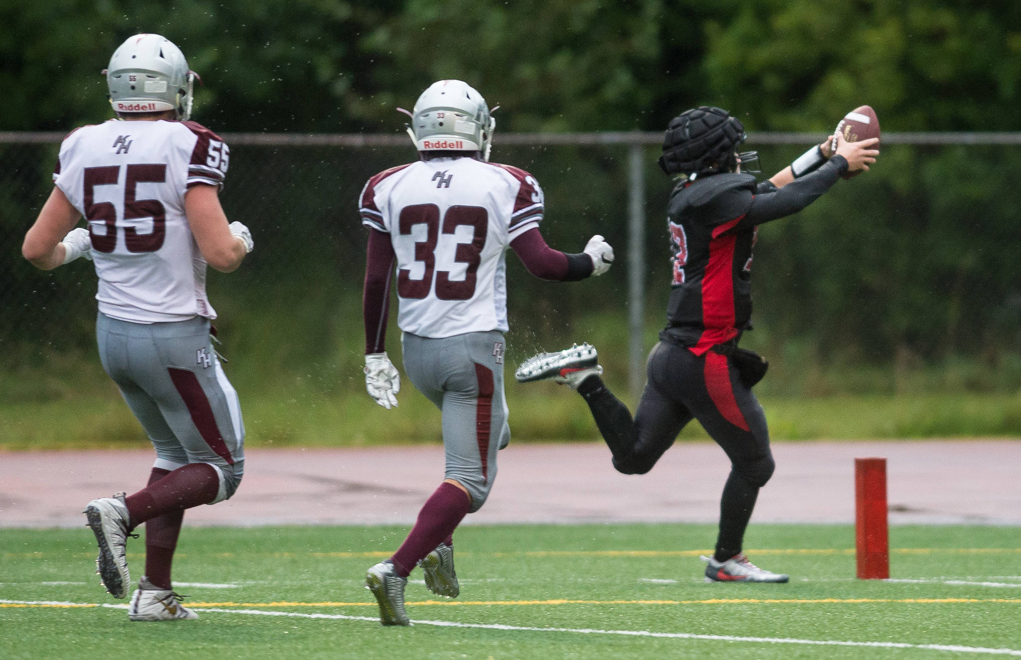 Juneau-Douglas&rsquo; Bubba Stults runs for a touchdown against Ketchikan after making an interception at Adair-Kennedy Memorial Field on Saturday, Aug. 19, 2017. JDHS won 32-8. (Michael Penn | Juneau Empire)
