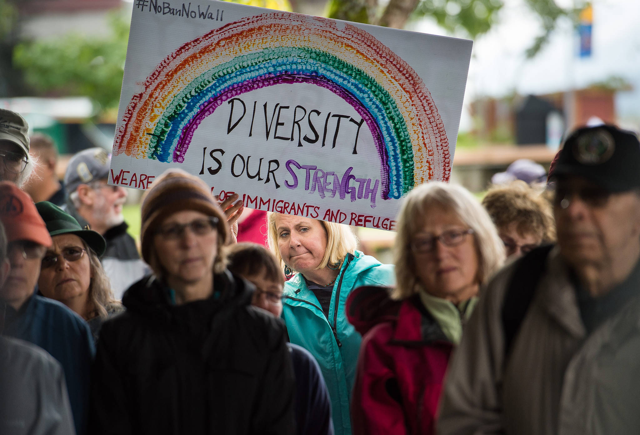 Heather Hardcastle holds a diversity sign while attending a Unity Rally against recent racial violence in Charlottesville at Marine Park on Sunday, August 27, 2017. (Michael Penn | Juneau Empire)