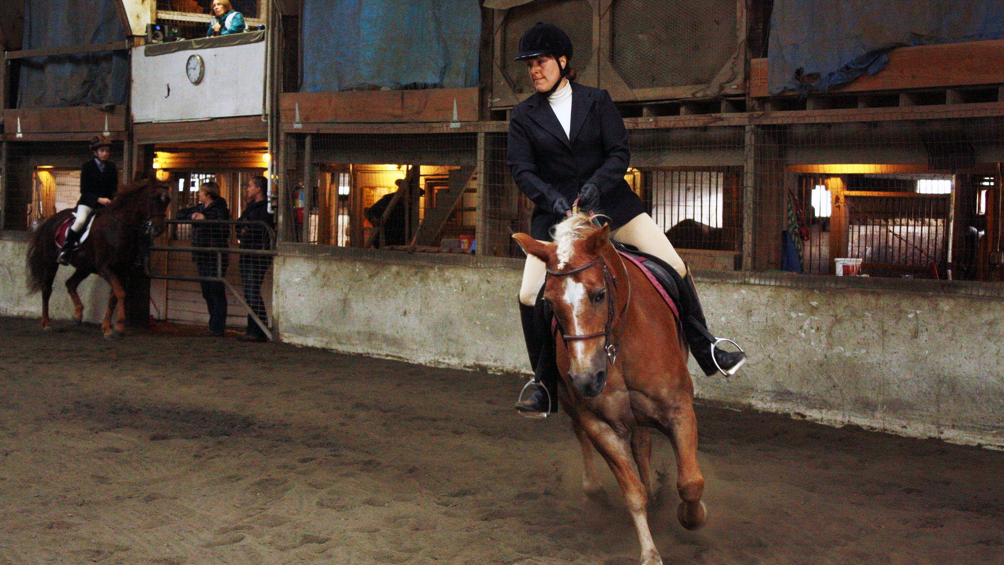 Wendy Smiths, 40, rides Maraquise in a trot during a English style class Saturday, August 26, 2017. (Erin Laughlin | For the Juneau Empire)