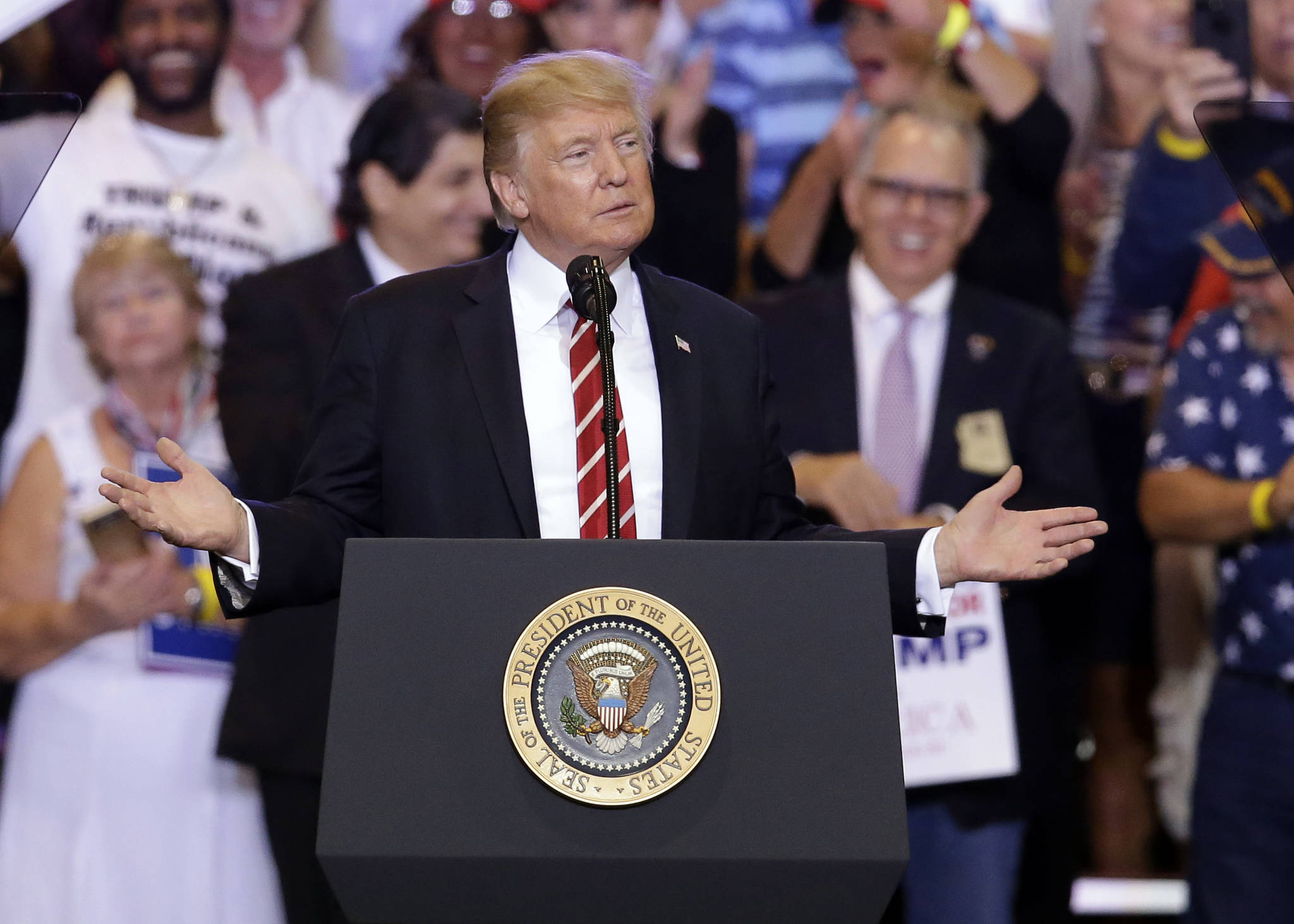 President Donald Trump gestures to the crowd while speaking at a rally at the Phoenix Convention Center Aug. 22 in Phoenix, Arizona. (Rick Scuteri | The Associated Press)