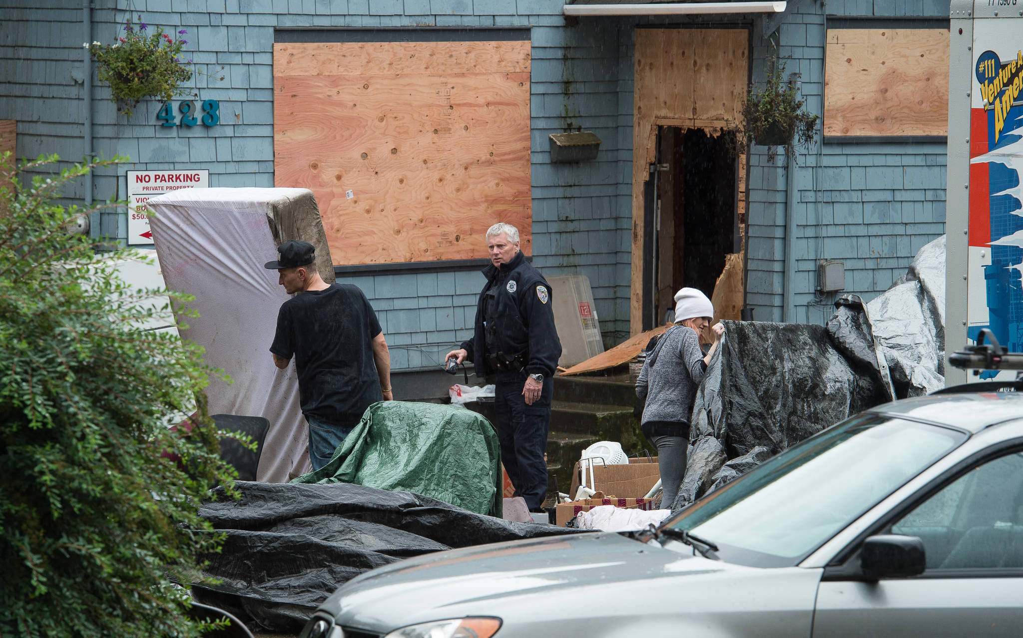 Two houses owned by Kathleen Barrett are shown boarded up on Friday, Sept. 8, 2017. Police were called after renters kicked one door in to gain access to the building. (Michael Penn | Juneau Empire)